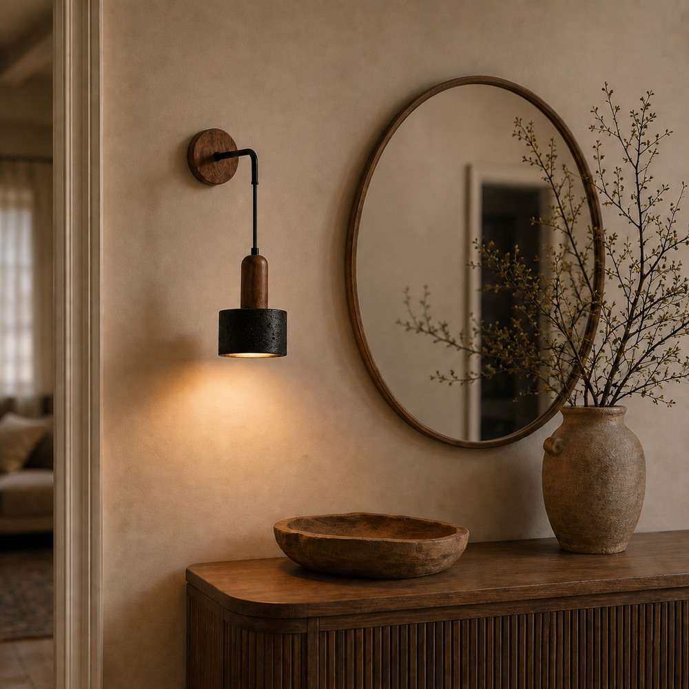 Applique en pierre noire au-dessus d'une console d'entrée avec miroir #pierre-noire